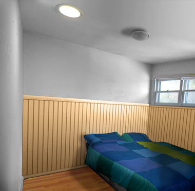Image manipulation: Photoshop mockup of the room with panelling and a bed